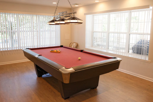Lounge area with pool table and large windows